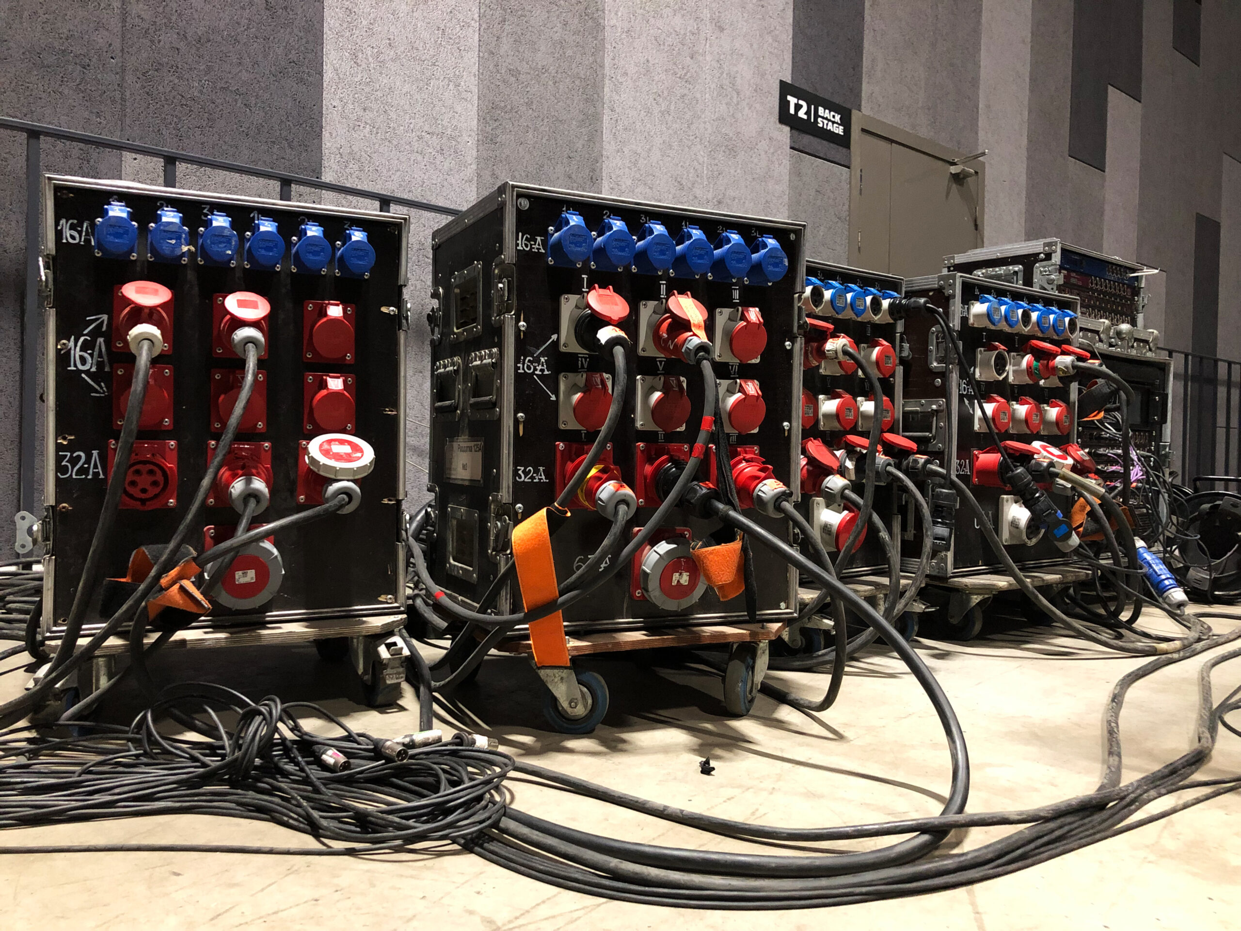 Electric power distribution boxes with power and signal cables. Installation of professional equipment for a concert.