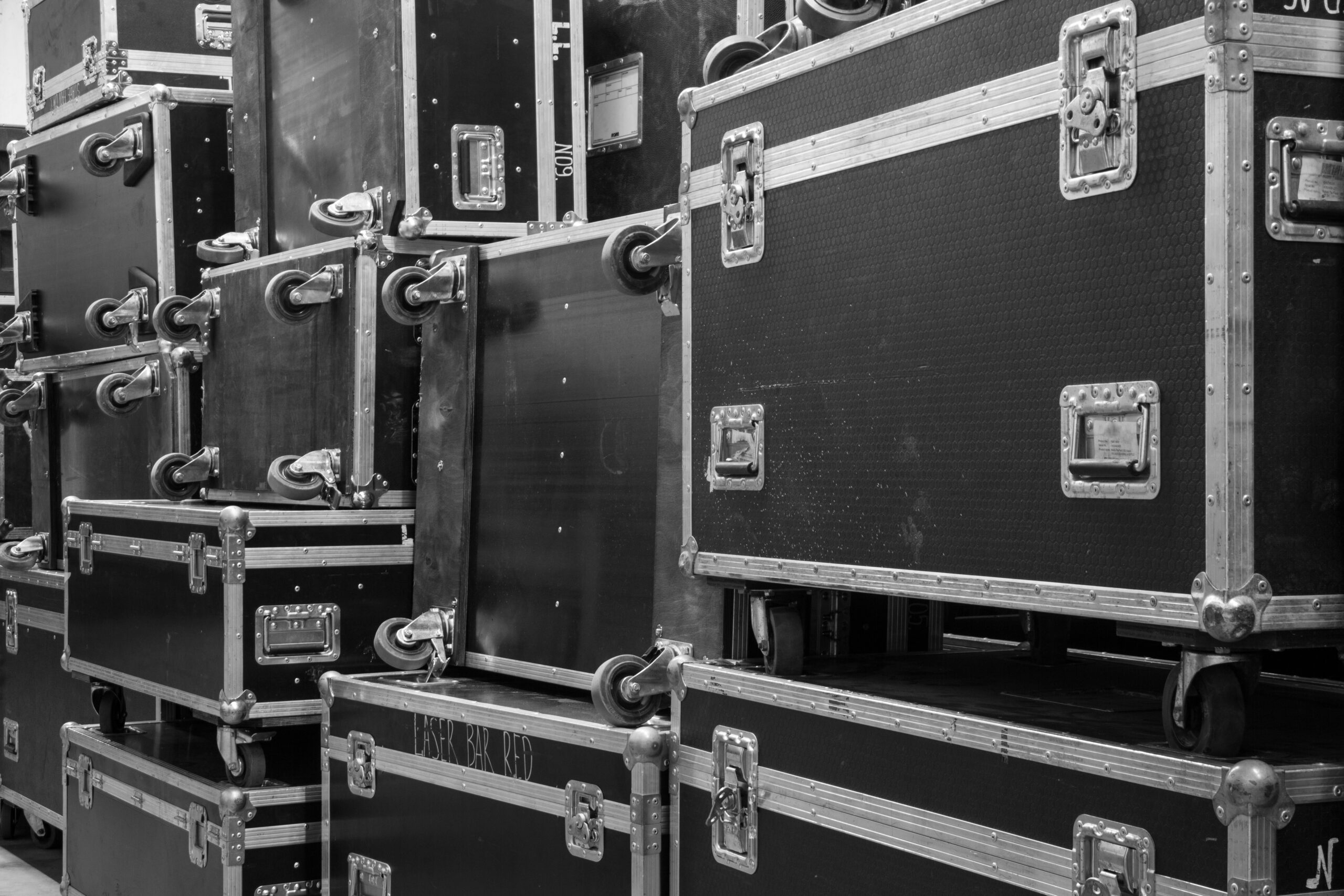 Protective flight cases on backstage zone. Storage with empty flight cases from professional concert equipment.